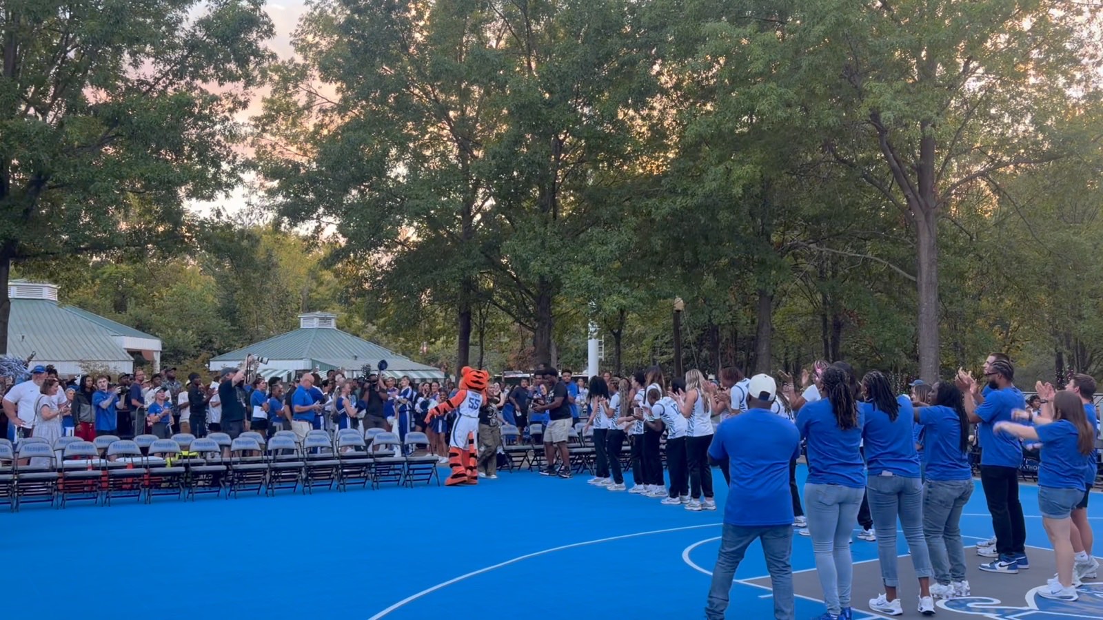 Fans gathered around the open-air court watching the event